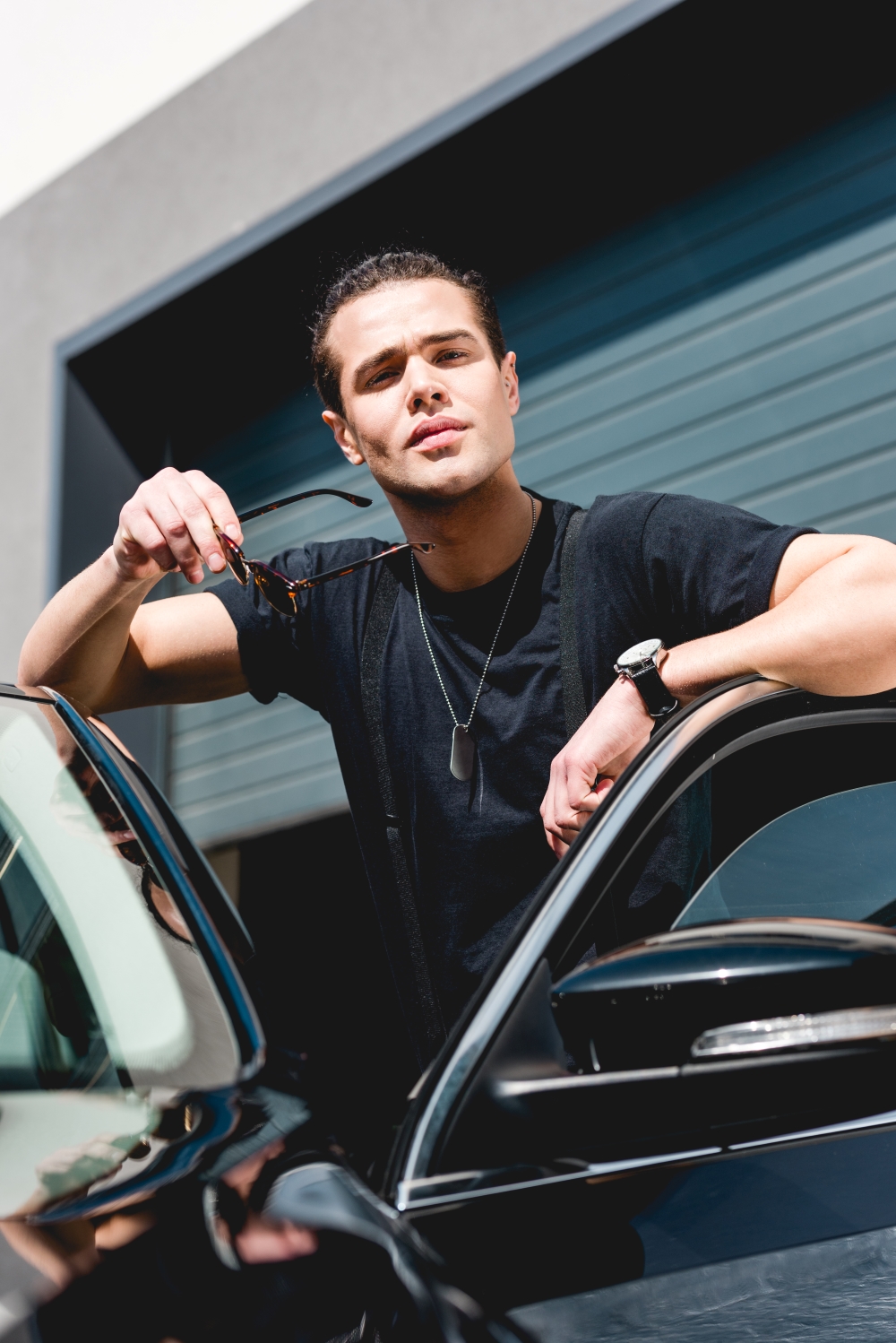 Man leaning on car