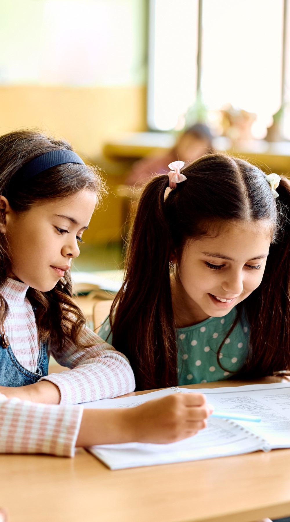 happy-schoolgirls-learning-together-on-a-class-at-2023-06-13-17-16-41-utc